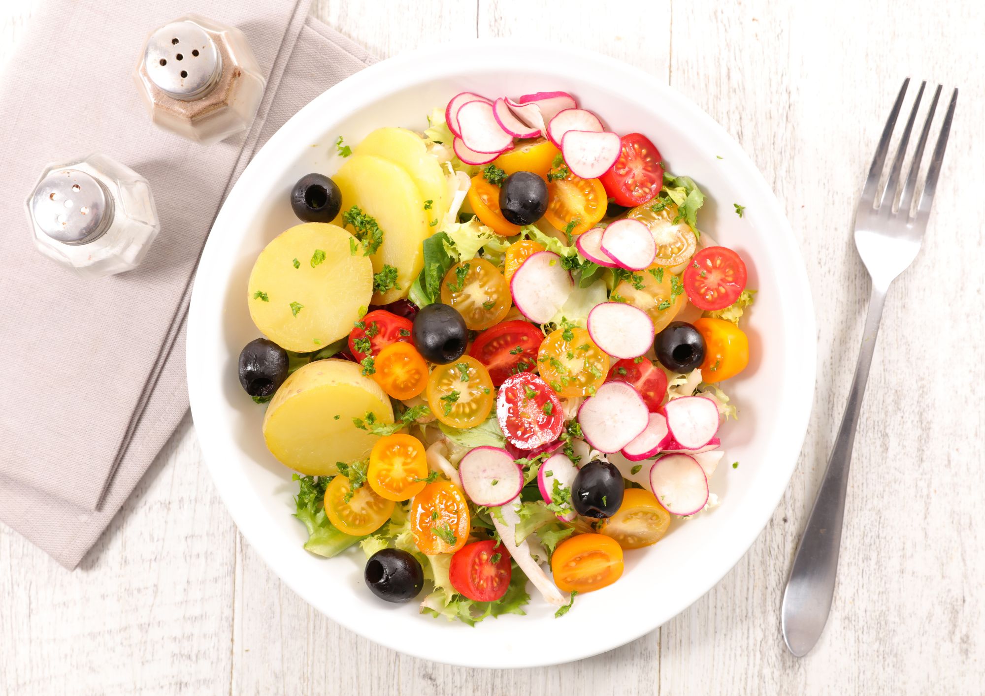 Levante potato salad with radishes, baby tomatoes and olives