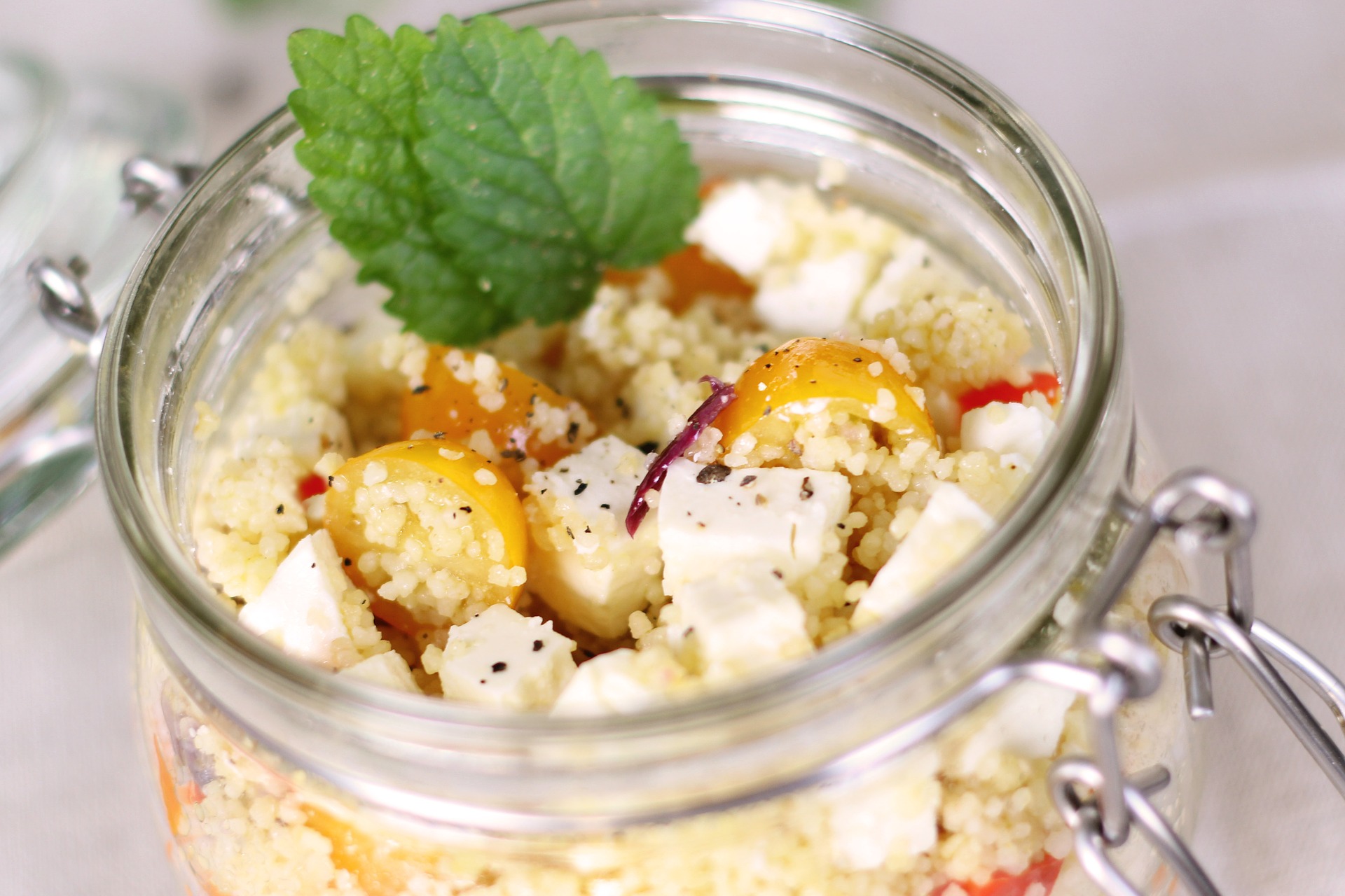 Mini jars of cous cous with vegetables and feta
