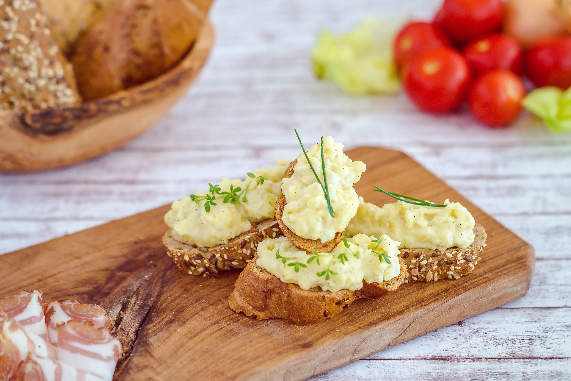 Mixed seed crostini with creamy potato sauce